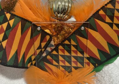 Colorful fabric and feathers with decorative object.